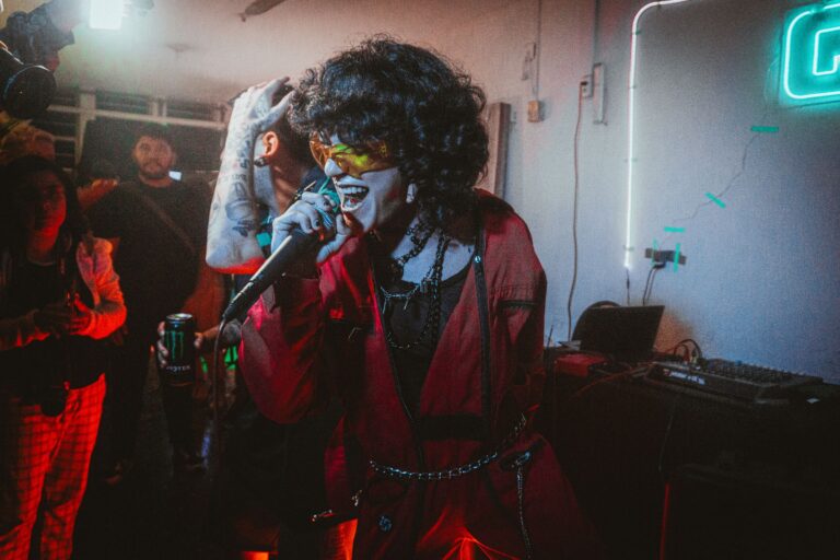 A singer performing among an audience in a nightclub.